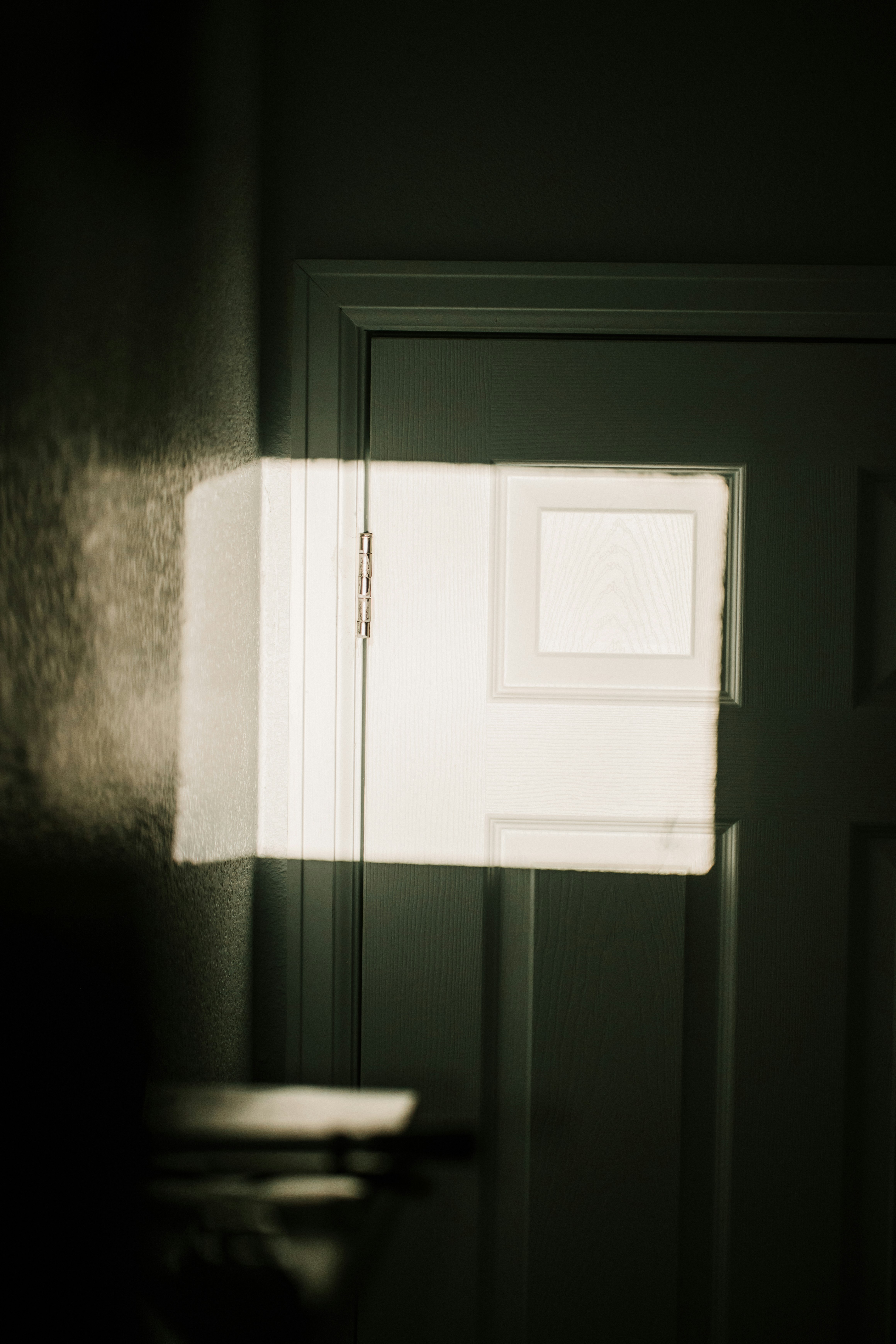 white wooden door with silver door lever